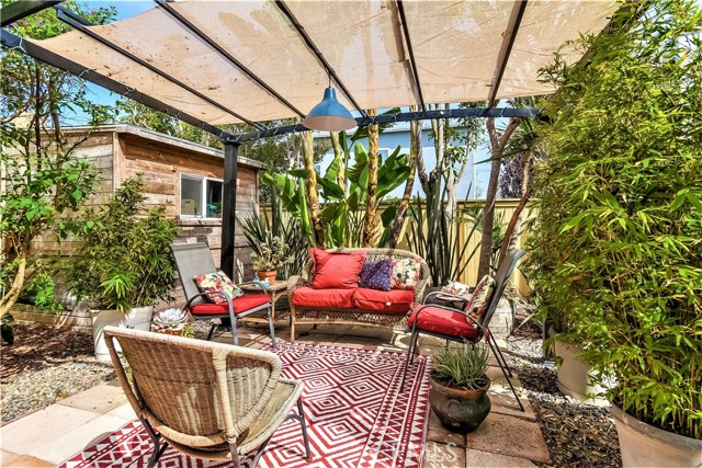 This is a wonderful place to start your day with coffee and the papers and a to end your day relaxing or entertaining.  The vintage looking storage room adds a charming touch to the patio