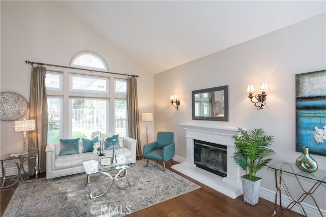 Beautiful Living room with fireplace & wall lights.