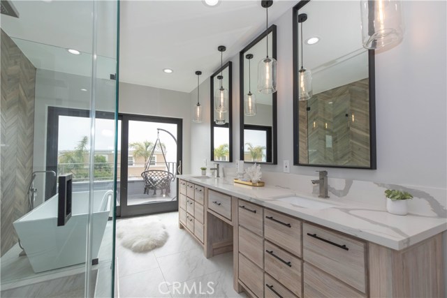 Spacious Master Bath with Dual Vanity Sinks, Quartz Counters, and Soaking Tub