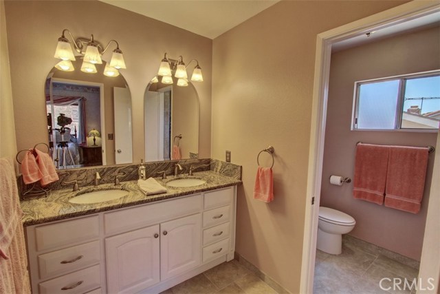 Master bath with updated cabinets, tiled floors and granite counters.