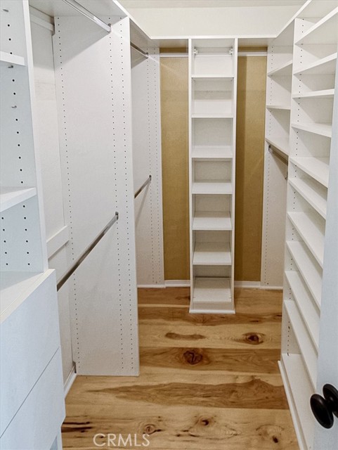 Custom walk in closet cabinetry and shelves