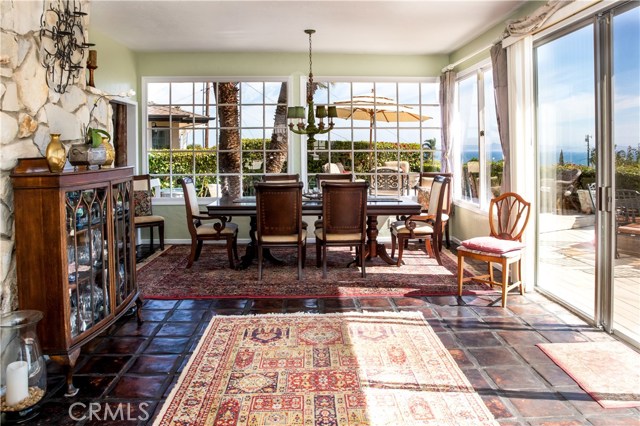 Sun room with a great view and lots of glass, and access to the deck and rear yard.