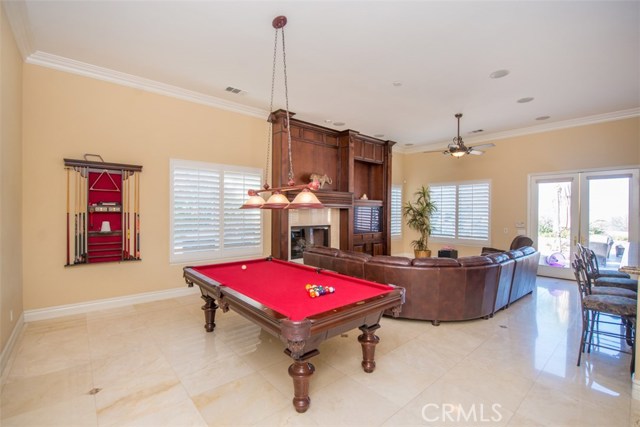 Large Game Room/Family Room with Built-in Media Center and Fireplace.