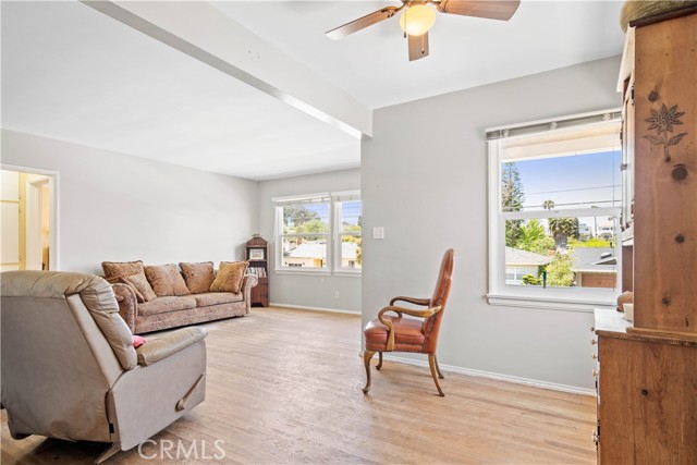 Picture taken from dining area. Window to right of chair has view of front covered porch.