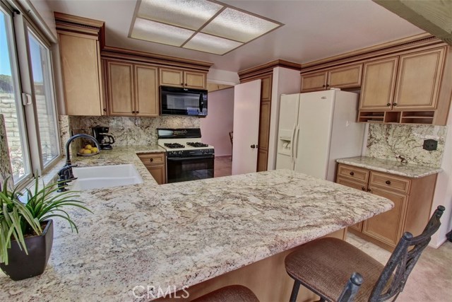 Another view of the kitchen that has additional seating