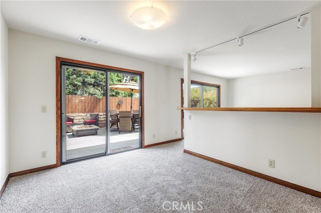 Main level family room, both sliders lead to rear patio deck