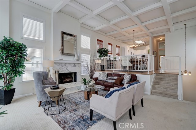 Beautiful marble fireplace and new carpet completes this spacious living room.