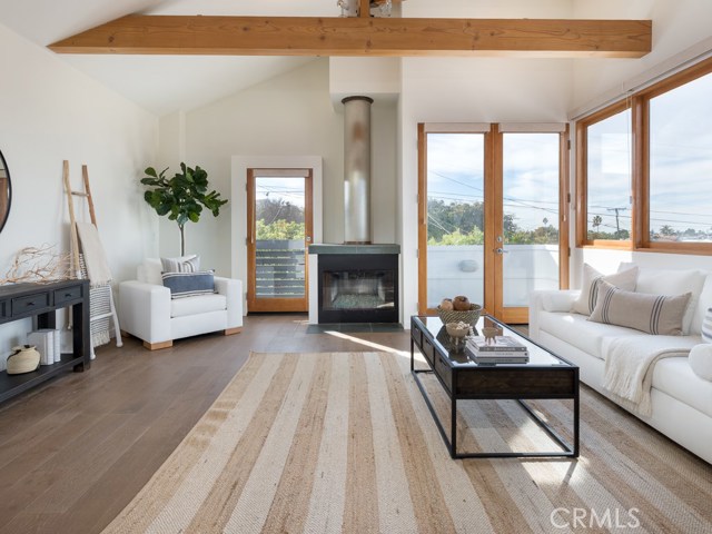 Great room with fireplace and balcony