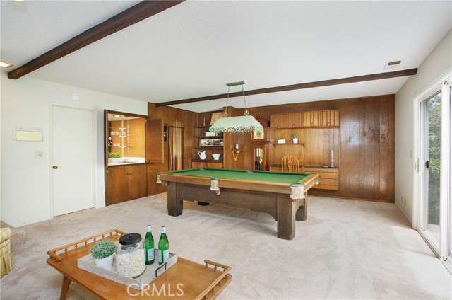 Built in wet bar with doors and sink could even be next gen suite with kitchenette?