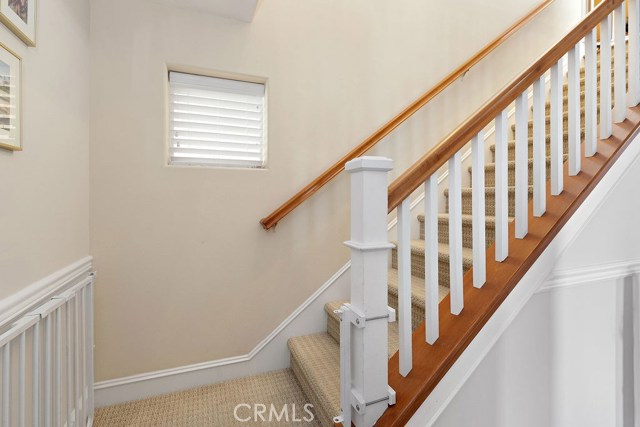 Wood bannister stair way to main level