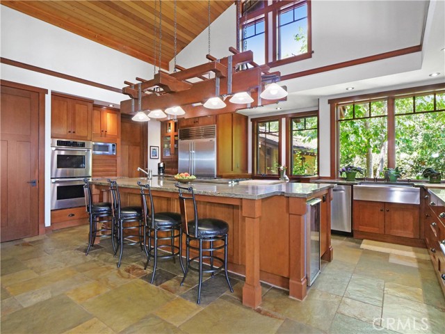 Inviting Island Kitchen with walk-in pantry and dumb waiter.