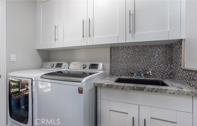 Laundry room with deep utility sink.