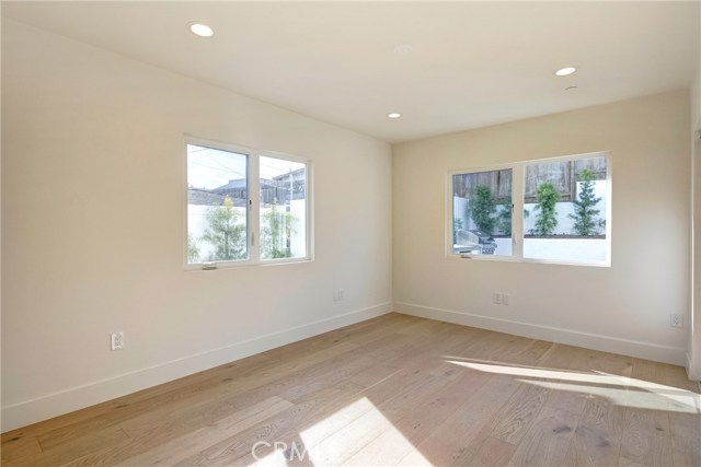 Downstairs large bedroom suite - absolutely tons of natural light.  Located to rear of home.  Private hallway to this suite.