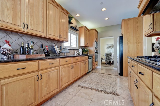 A plethora of cupboard storage and granite countertops make this kitchen a chef's dream.