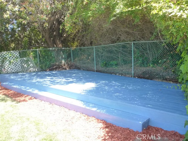Beautifully shaded wood deck from the mature tree growth.