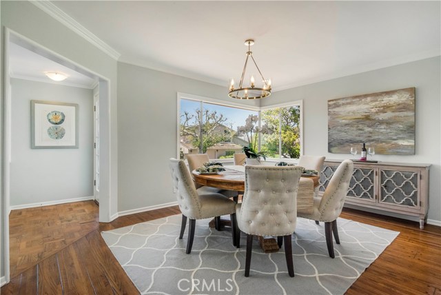 Large dining room with hardwood floors and new chandelier