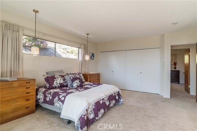 Master bedroom with original hanging side lamps