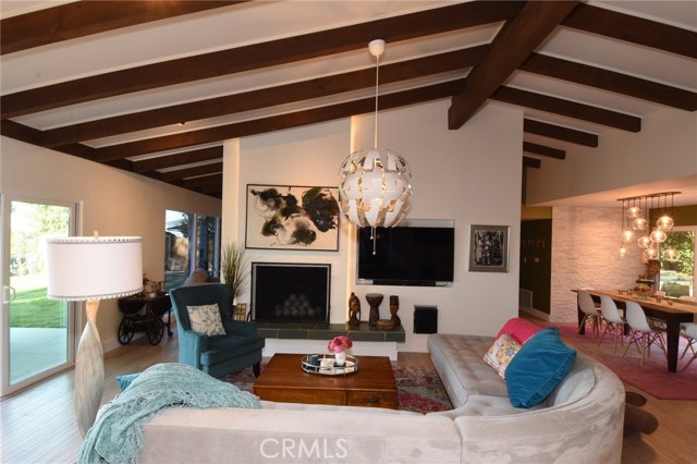 Another living room view with slider to the back yard, and dining room to the right.