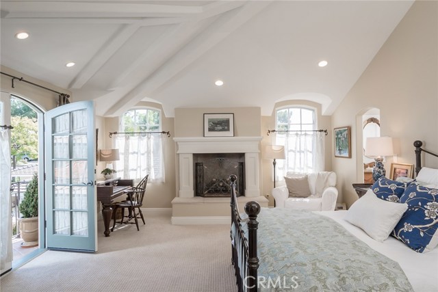 Master Bedroom Suite with Detailed and Vaulted High Ceilings and Gorgeous Fireplace