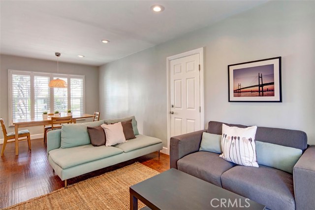 Living & dining area looks out to front porch