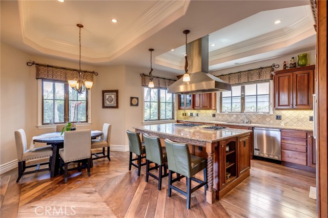 Gourmet kitchen with granite countertops and seating area