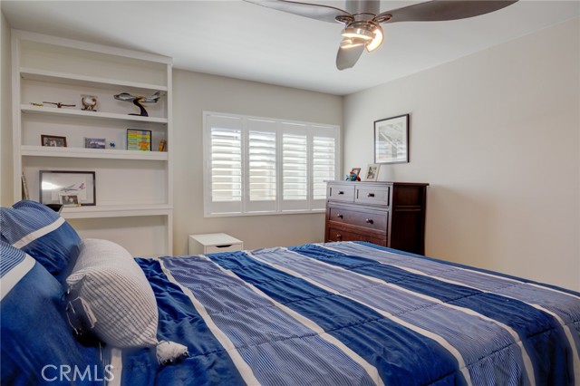 Large bedroom with new windows and shutters.