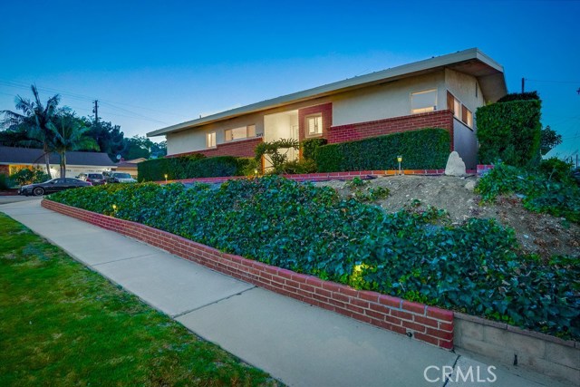 Evening pictures of this unique home on prime lot.