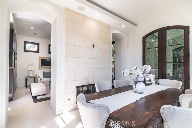 Formal dining room with pass-through fireplace to living room