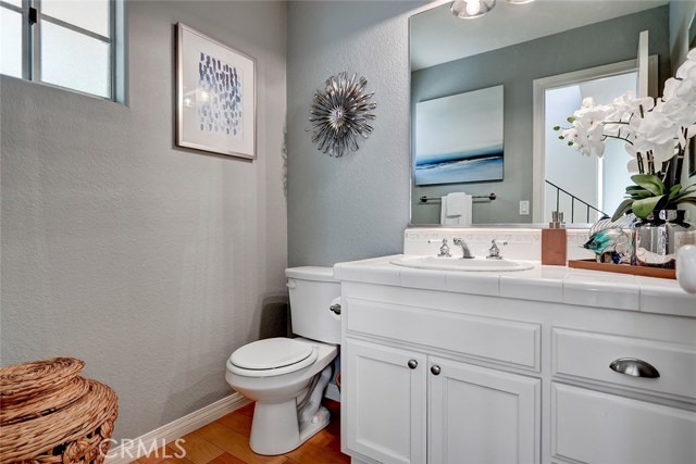 Conveniently located powder room at living area level.