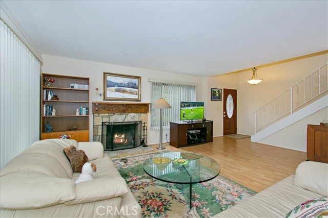 Living room with stairway to 3 bedrooms Living room with stairway to 3 bedrooms