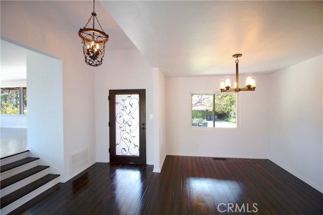 Elegant front door and dining area