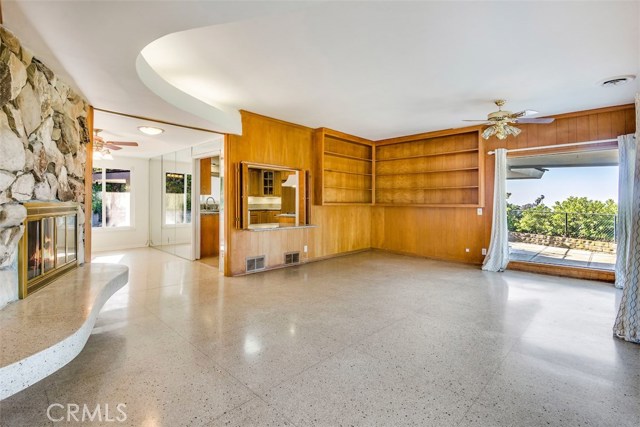 Large Family Room with Fireplace and Built-in Shelves