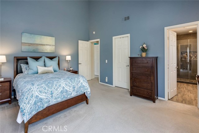 Large master bedroom with remodeled bathroom and walk in closet