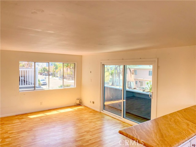 Living room and balcony - front downstairs unit (B).