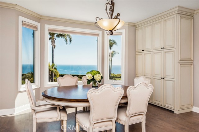 Beautiful eat in kitchen area with bay window views of the ocean and additional storage cabinets