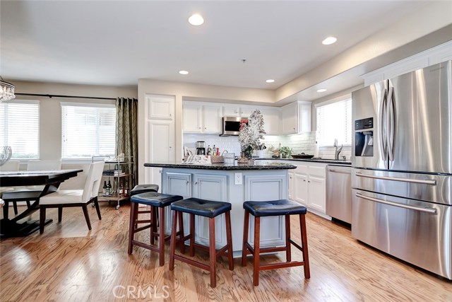Recently updated kitchen with granite countertops, stainless steel appliances and recessed lighting.