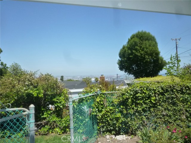 View from the backyard covered patio looking towards the ports of San Pedro and Long Beach.  On a clear day you can see downtown Long Beach too!