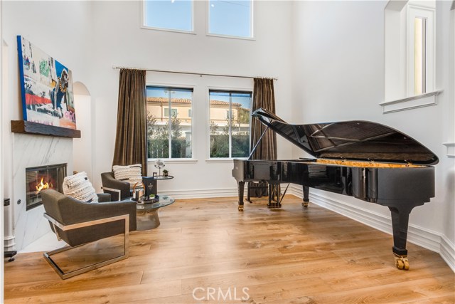 The formal living room is currently functioning as a classic music room.