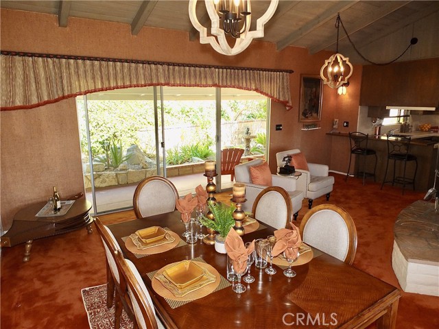 The dining area is adjacent to a beautiful fire place.