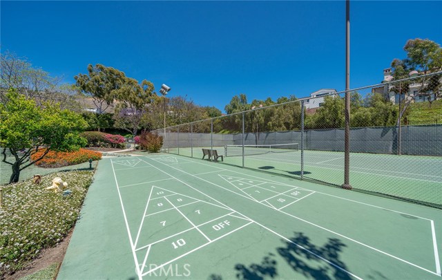 Two Shuffleboard courts surround the lighted tennis courts.