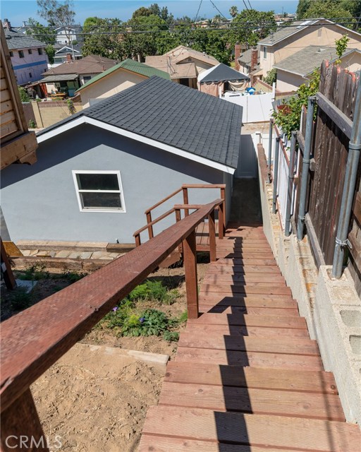 Steps to rear of street to alley lot, garage or lower outdoor area.