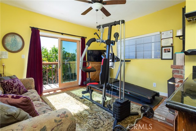 Bedroom Being Used as Den and Exercise, with Direct Access to Backyard.   3 of 4 Bedrooms.