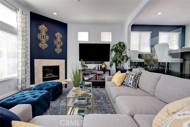 Spacious living room area with recessed lighting.