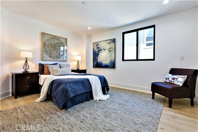 The 4th Bedroom has Can Lighting, a Large Closet with Built-ins, a Glass Panel Closet Door, Large Windows and Large Casing and Molding.