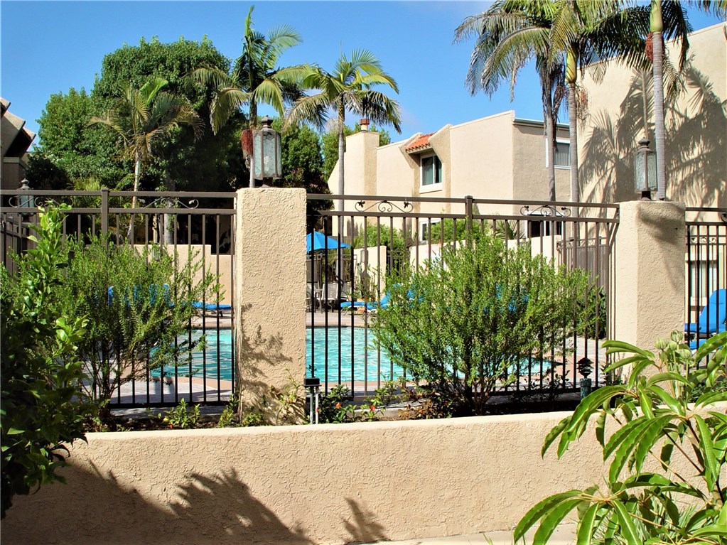 The meticulously maintained development is lushly landscaped with a pool and lots of guest parking