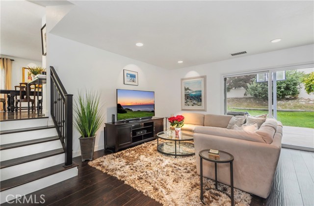 Step down leads to living room with backyard access. Step down leads to living room with backyard access.