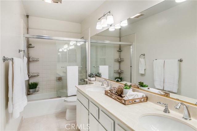 Master bathroom with hallway entrance.