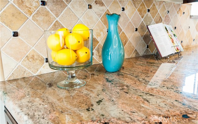 Granite countertops meet stone backsplash.  Perfect combo!