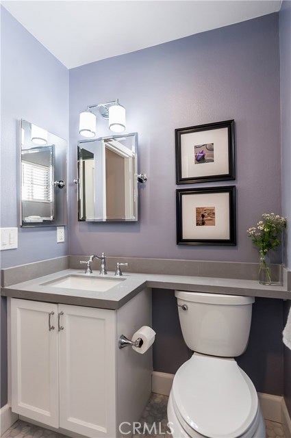 The hall bath was beautifully renovated with quartz countertops, carrara marble tile and a soaking tub.