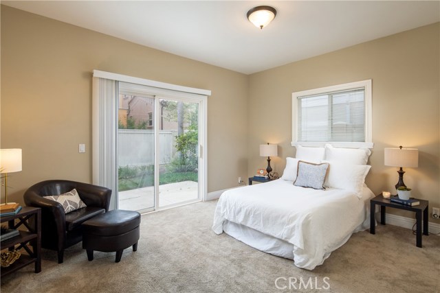 Bedroom #2 - A spacious retreat with large closets and direct access to the private backyard.